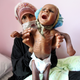 A woman holds her malnourished child at a therapeutic feeding centre at al-Sabyeen hospital in Sanaa April 15, 2013. (Reuters /Mohammed al-Sayaghi)
